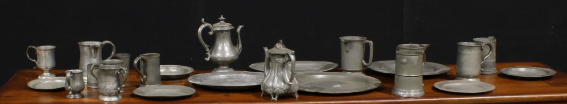 A George III pewter charger, 42.5cm diam, c.1800; others, plates; beer mugs; etc (qty)