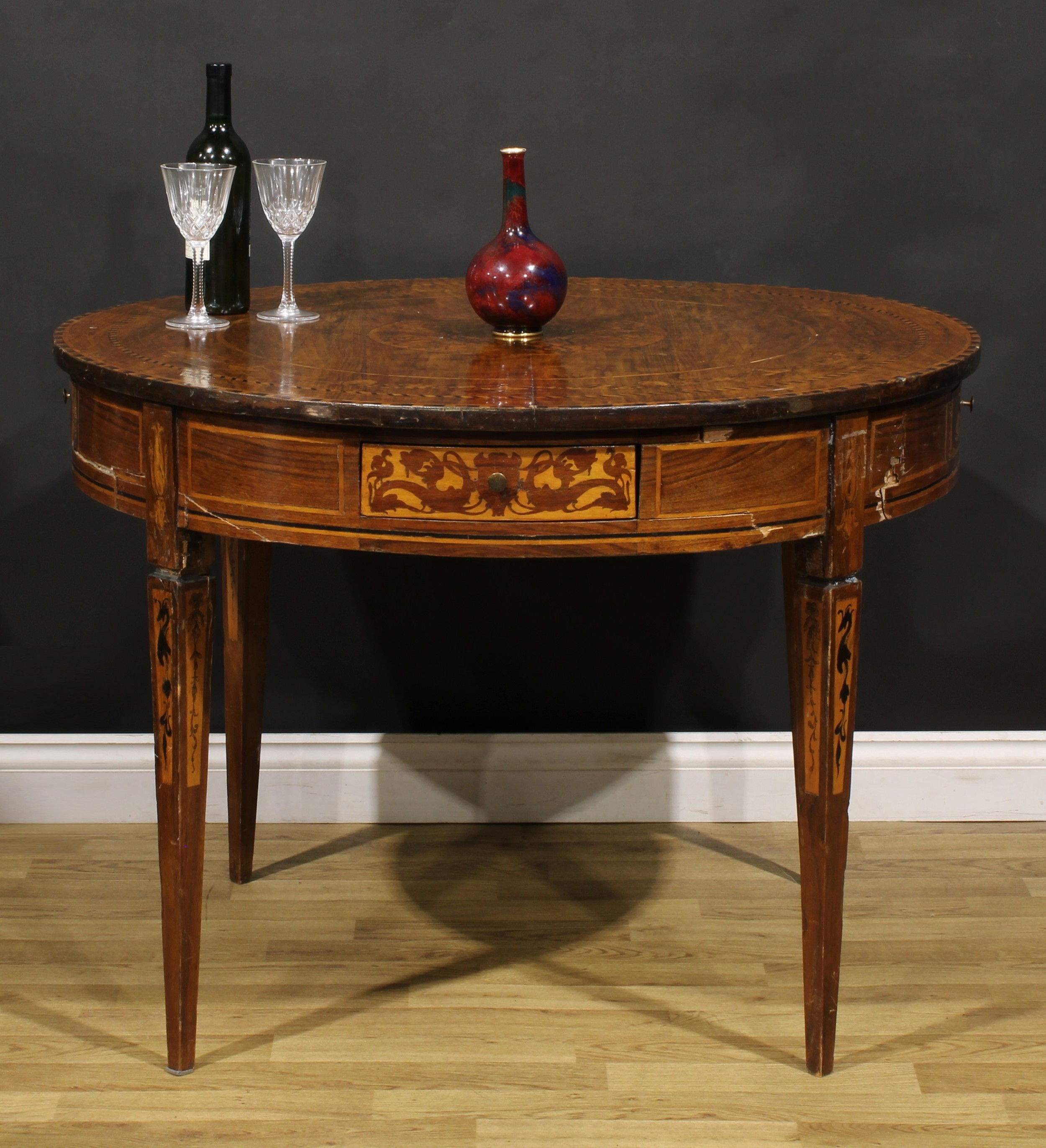 An early 20th century Italian marquetry centre table, circular top, tapered square legs, 74.5cm