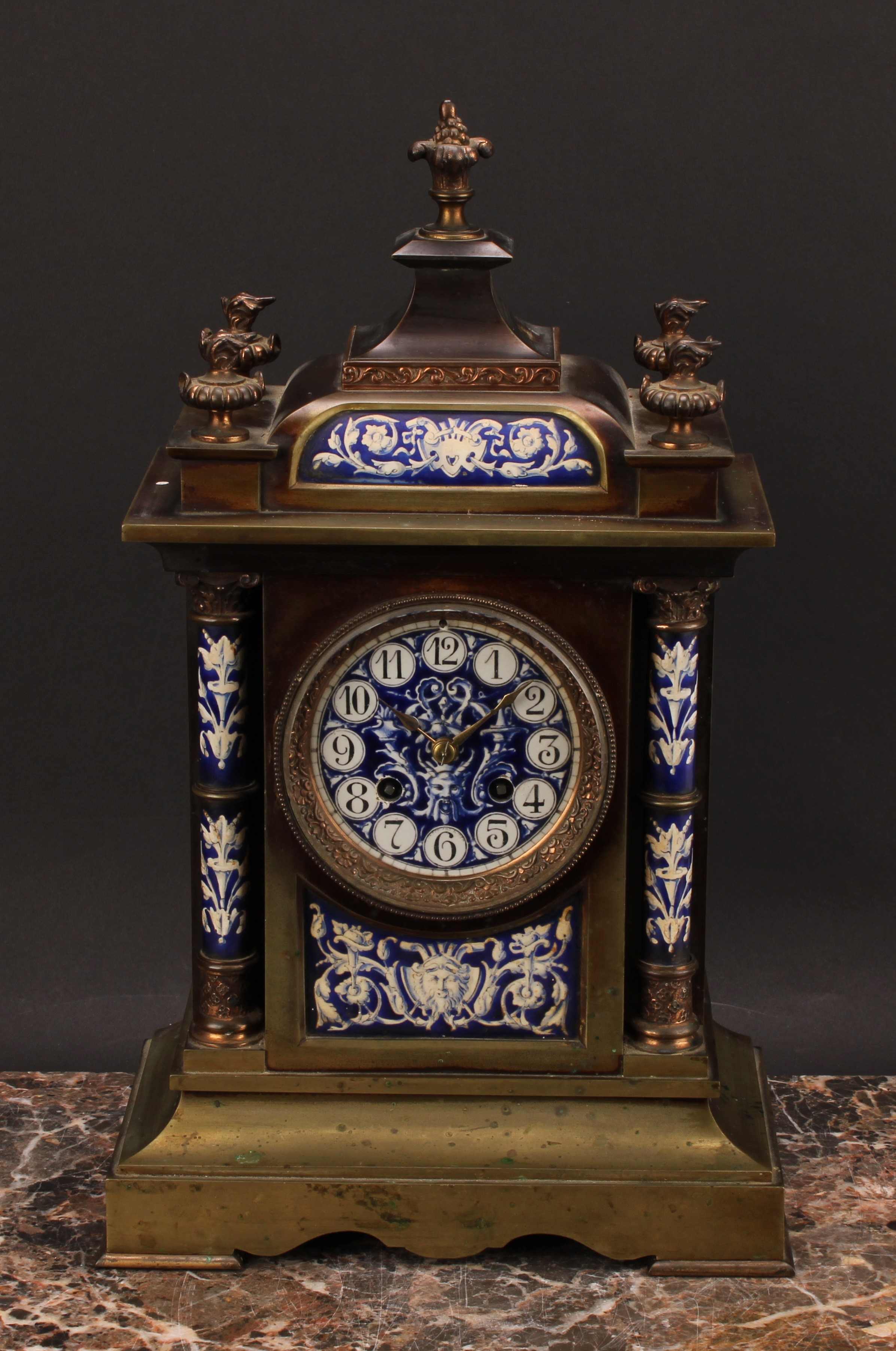 A late 19th century French porcelain mounted gilt brass architectural mantel clock, the 9cm circular