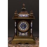 A late 19th century French porcelain mounted gilt brass architectural mantel clock, the 9cm circular