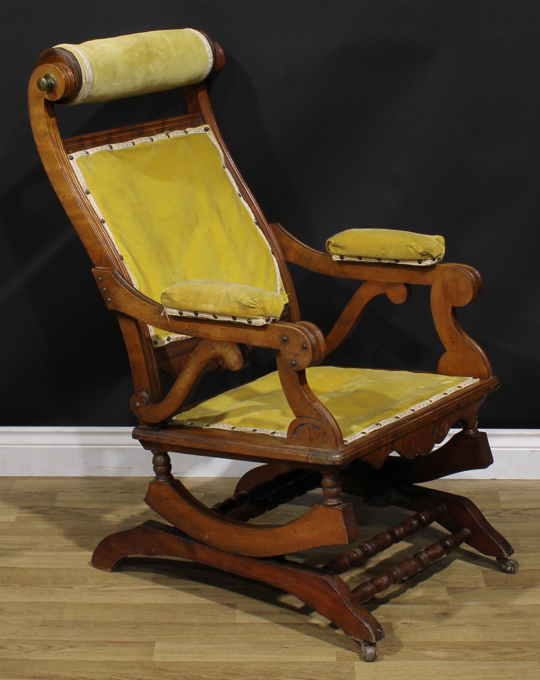 An unusual 19th century American walnut rocking chair, adjustable headrest, shaped arms, reeded - Image 2 of 4