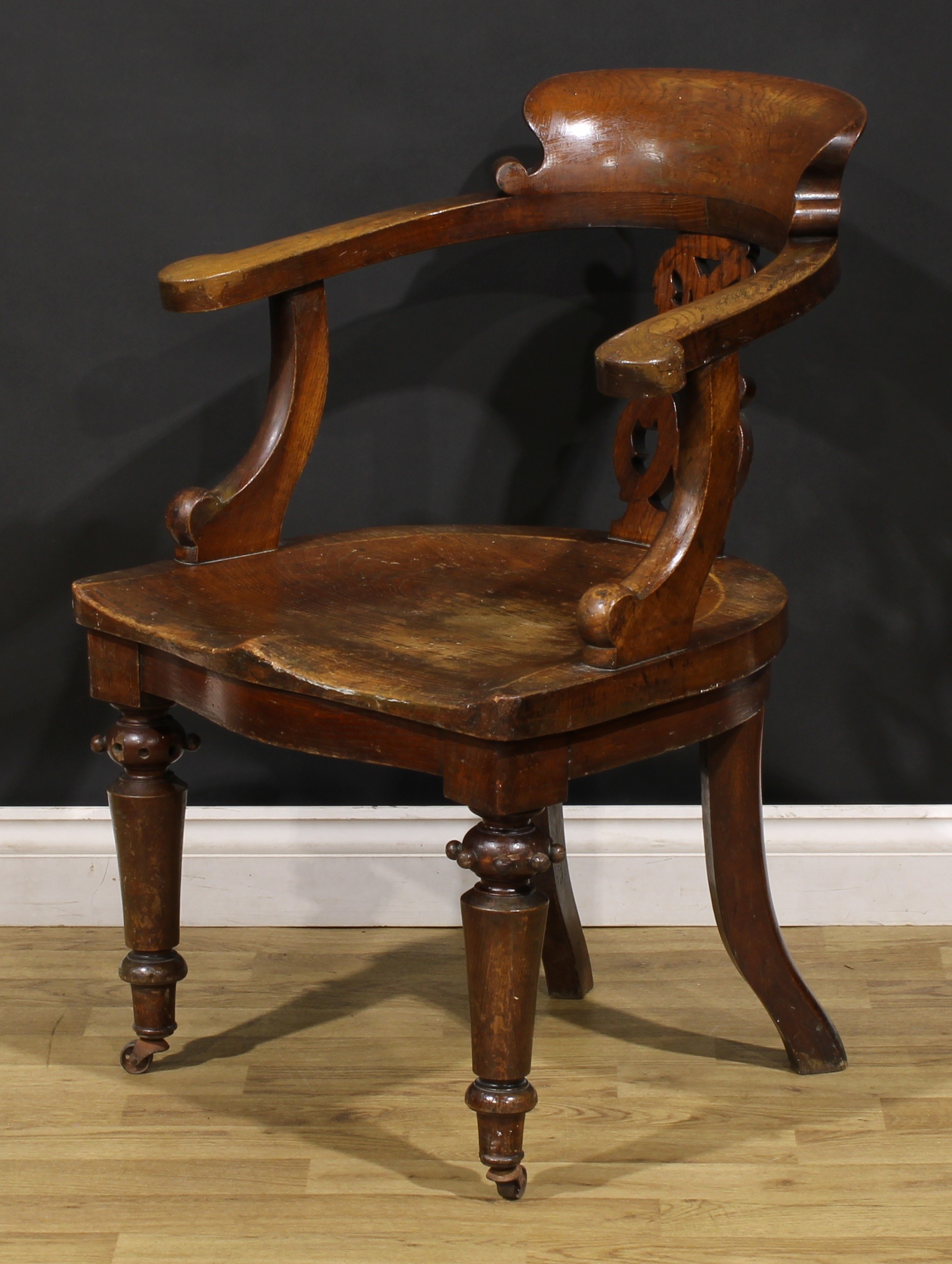 A Victorian oak desk chair, by Thomas Simpson & Sons, Halifax, Yorkshire (fl.1876-1954), badged, - Image 3 of 4
