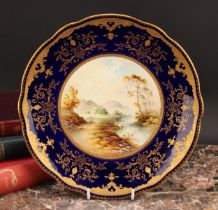 A Coalport Named View shaped circular plate, painted by P. Simpson, signed, Mount Dover, within