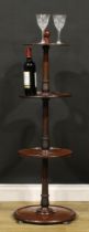 An early Victorian mahogany four-tier dumbwaiter, dished plateaux, shallow bun feet, 121.5cm high,