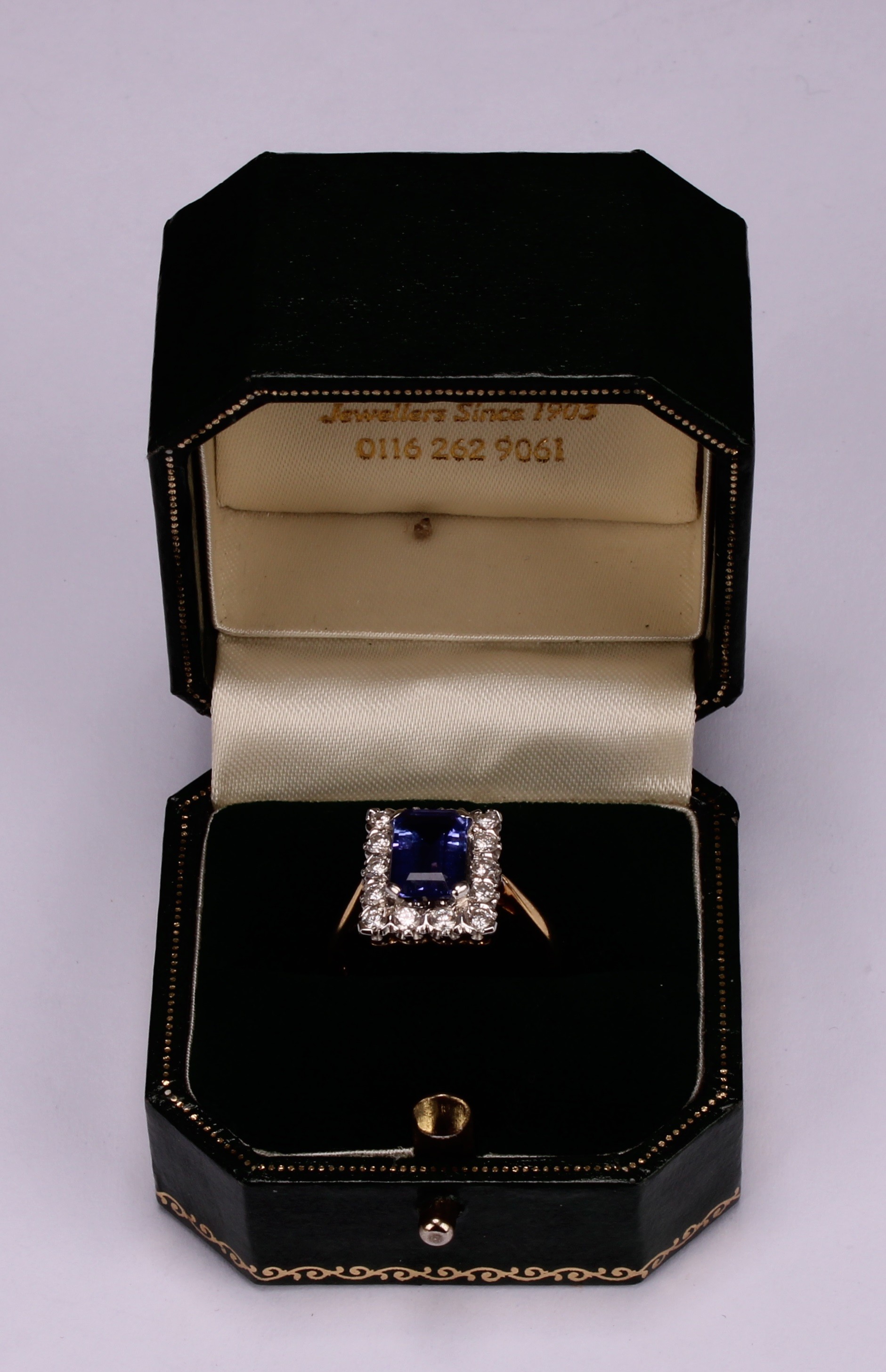 A tanzanite and diamond ring, the rectangular cushion cut stone claw set within a single band of - Image 5 of 5