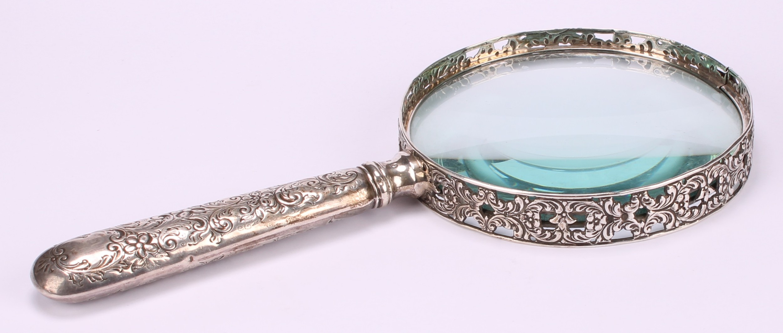 A Victorian silver magnifying glass, the bezel pierced and cast with flowering foliate scrolls, - Image 3 of 4