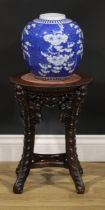 A Chinese hardwood jardiniere stand, circular top with beaded border and inset marble panel,