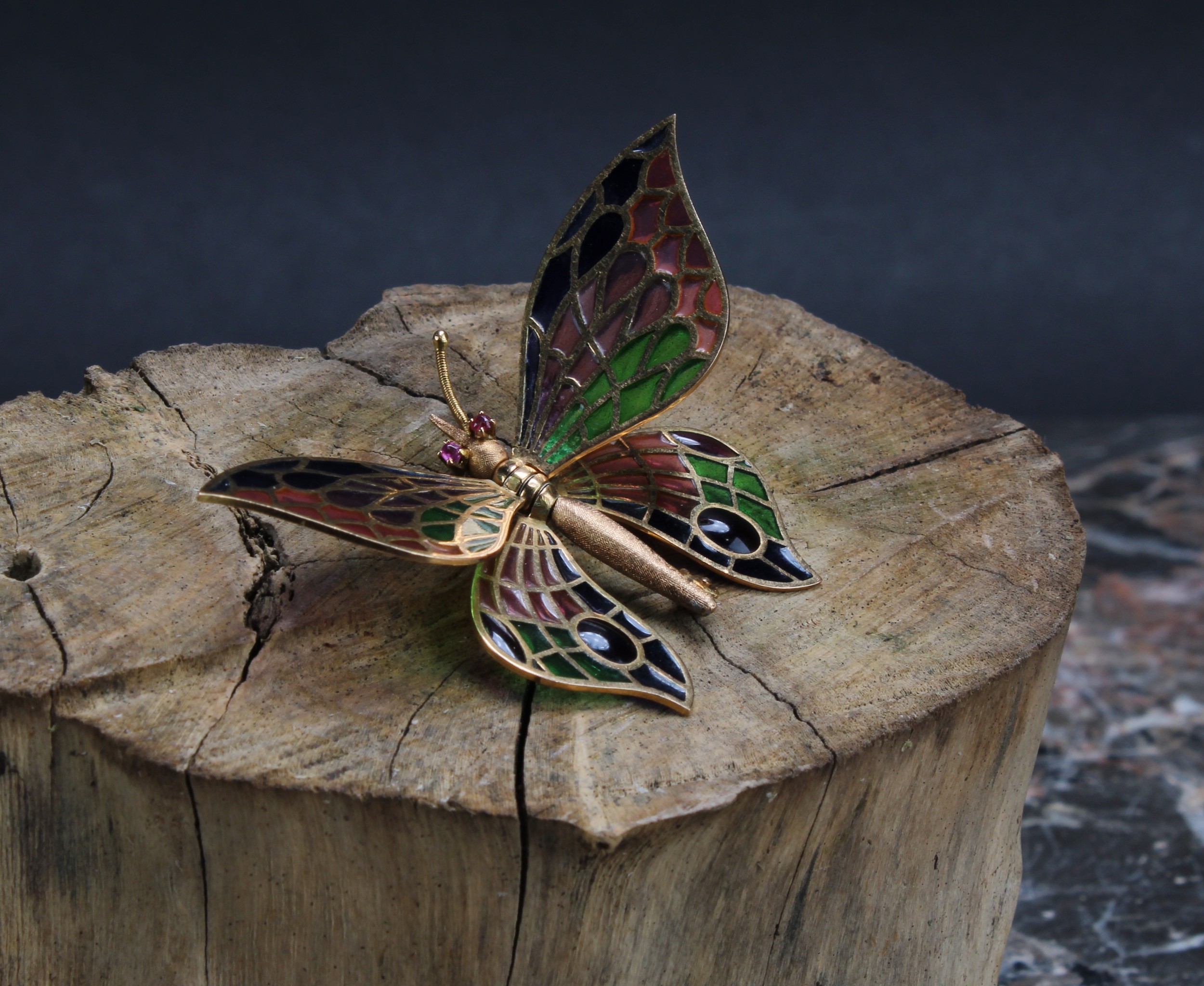 An 18ct gold and pique a jour enamel insect brooch as a butterfly, The head set with two small round