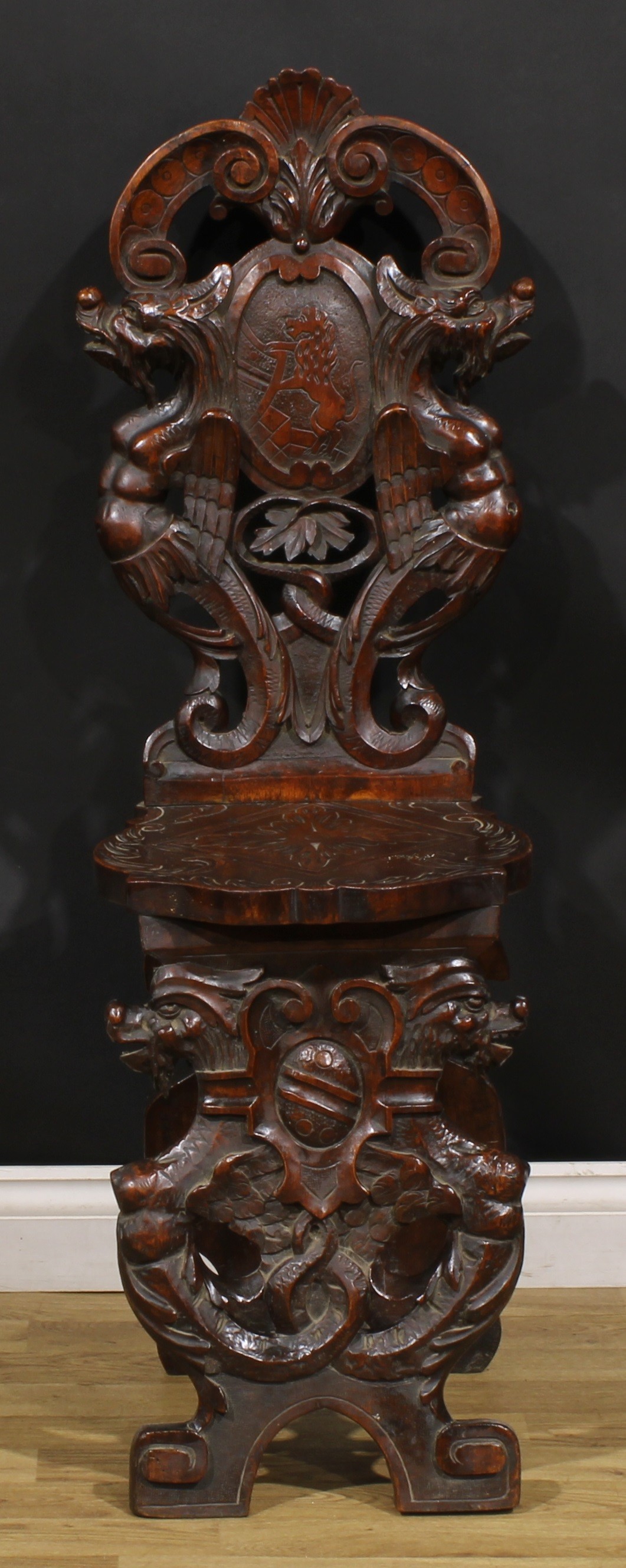 A pair of 19th century Italian walnut sgabelli or hall chairs, carved throughout in the - Image 6 of 9