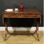 A Regency rosewood sofa table, crossbanded rounded rectangular top with fall leaves, above a pair of