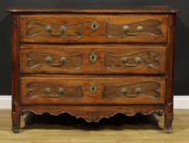 An 18th century French Provincial chestnut serpentine commode, slightly oversailing top with moulded