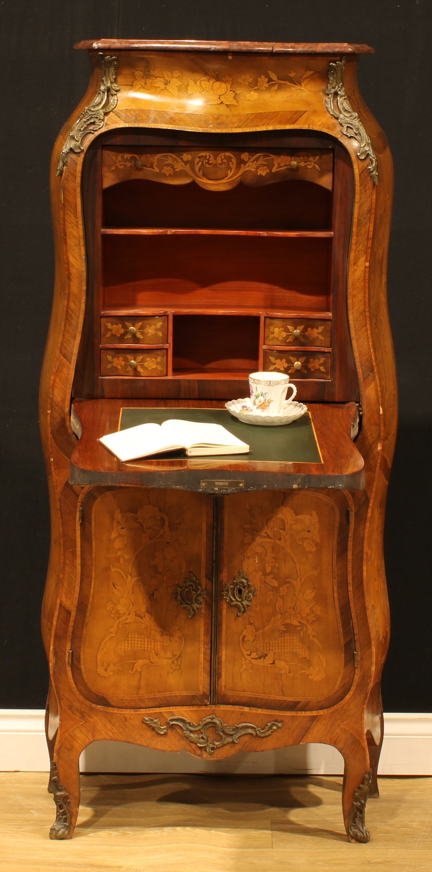 A late 19th century French Louis XV Revival gilt metal mounted rosewood banded and marquetry bombe