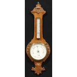 A late Victorian/Edwardian Essex oak wheel barometer, 18.5cm circular register inscribed R.A.