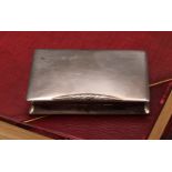A Continental silver waisted rectangular snuff box, hinged cover, quite plain, leafy thumbpiece,