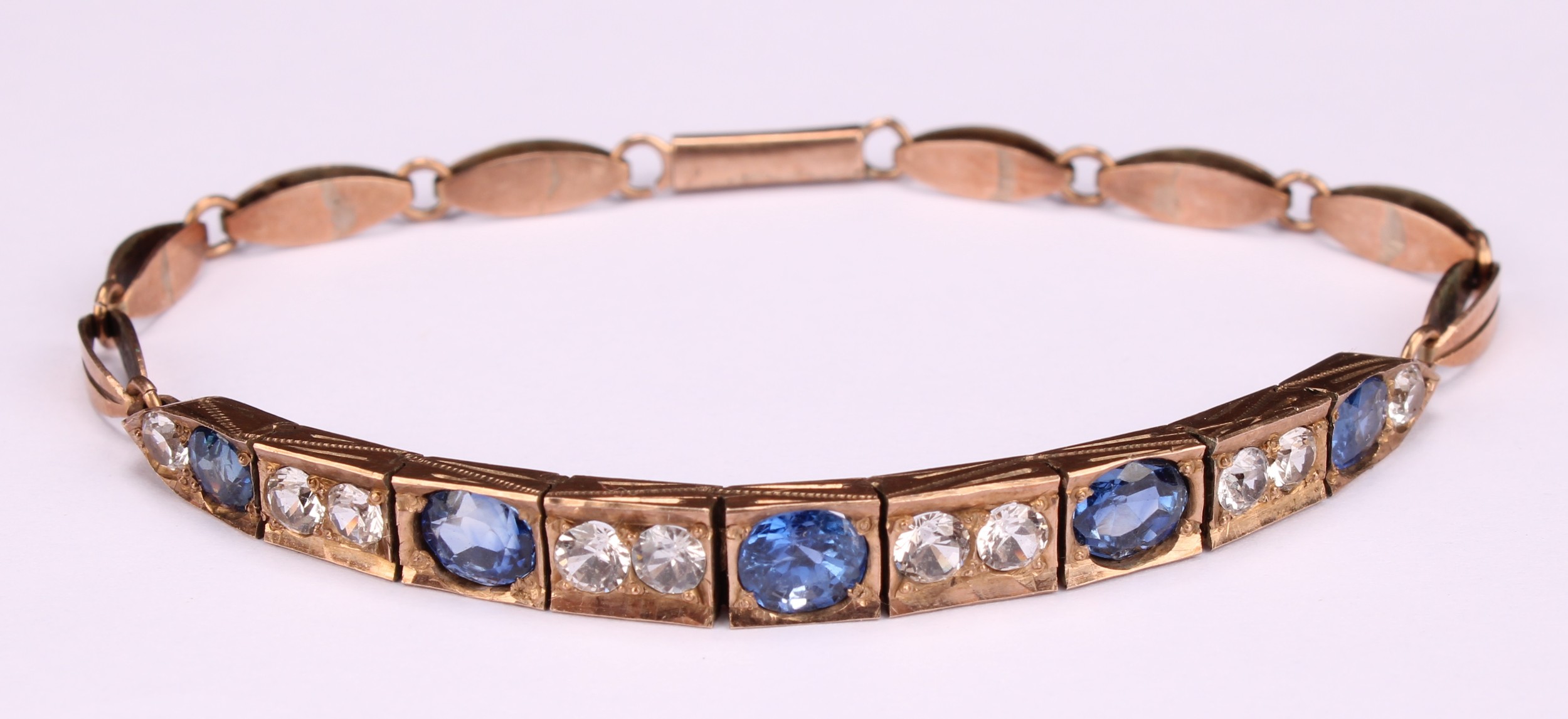 A rose metal mounted bluie and white sapphire articulated bracelet, set with five graduated blue - Image 4 of 5