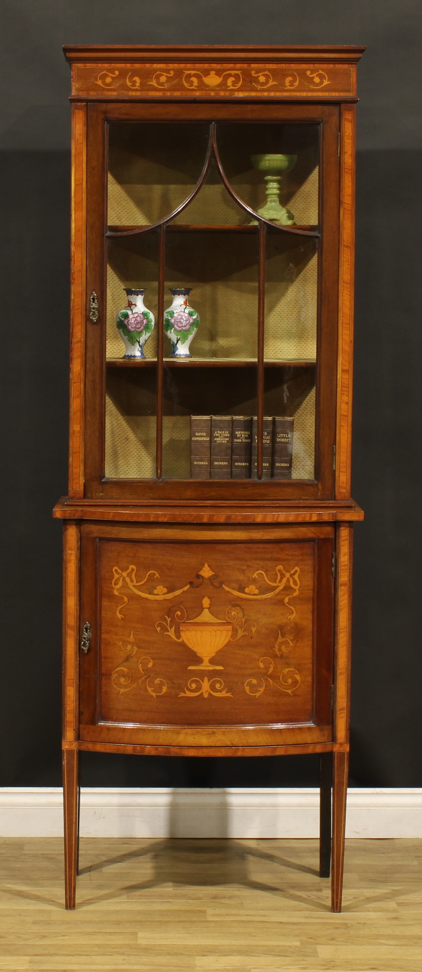 An Edwardian satinwood banded mahogany display cabinet, moulded cornice above a glazed door