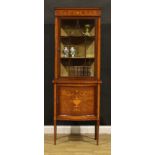 An Edwardian satinwood banded mahogany display cabinet, moulded cornice above a glazed door