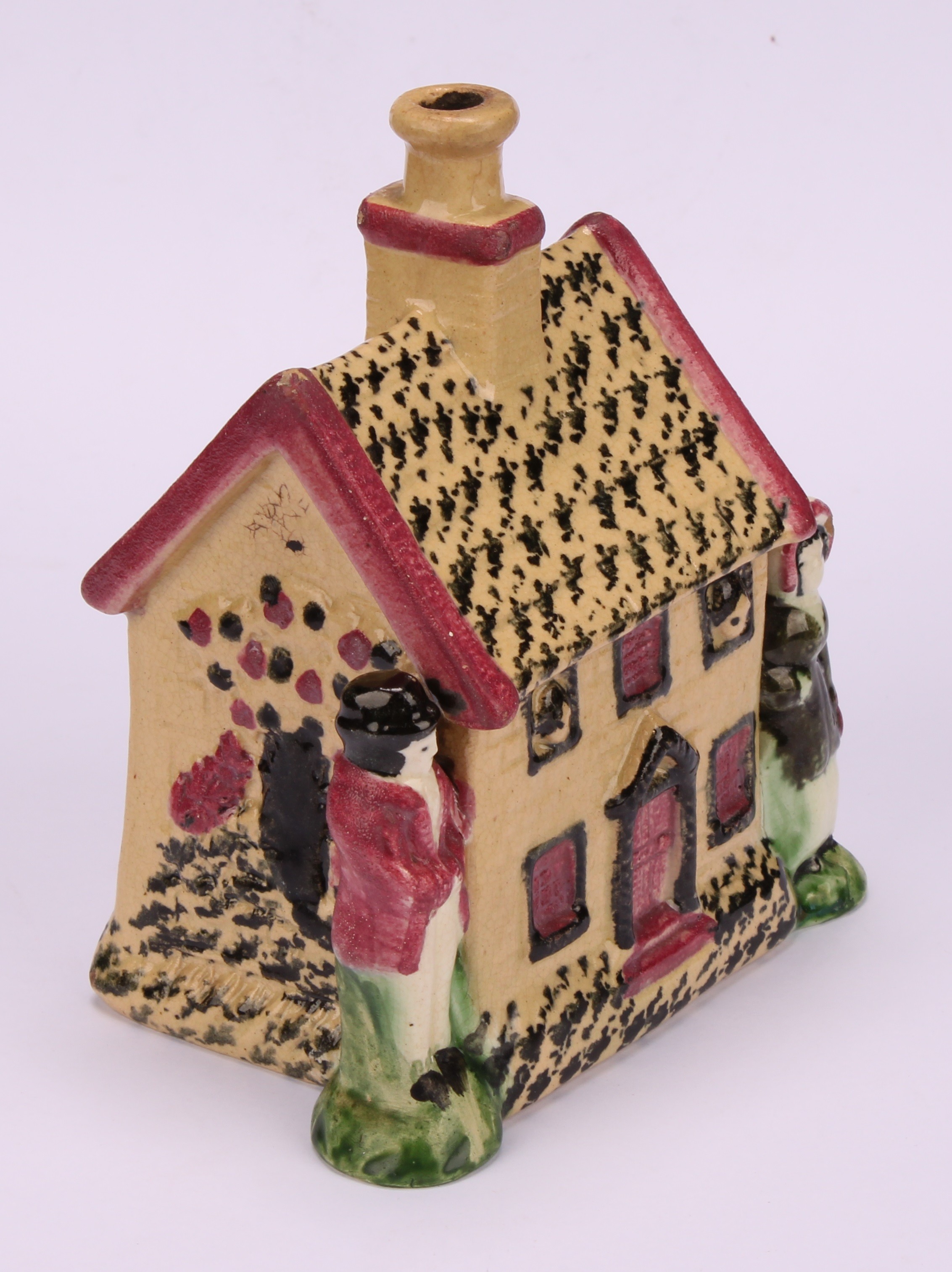 A Yorkshire Prattware polychrome spongeware cottage money box, moulded in relief with a figure to - Image 3 of 5