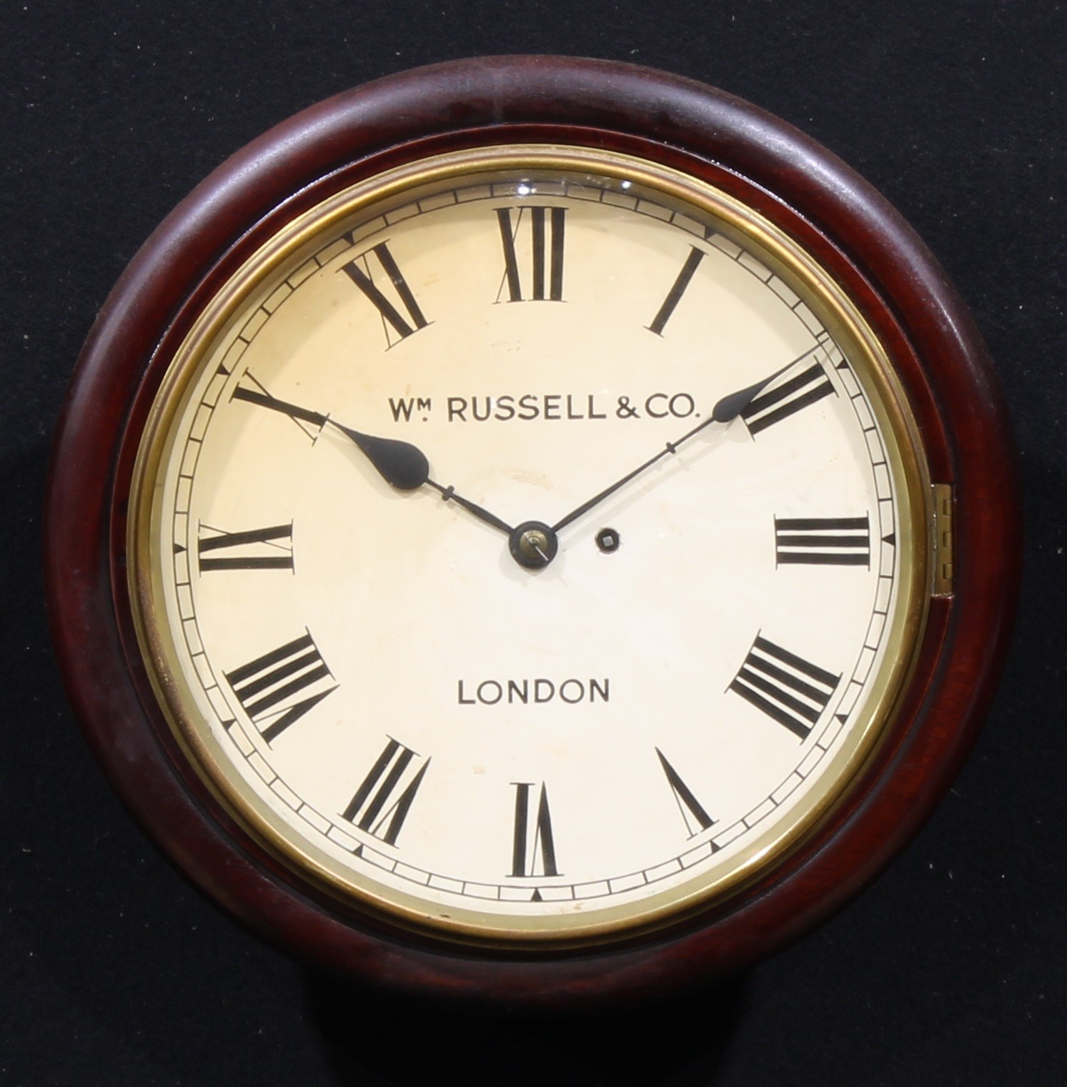 A 19th century mahogany circular wall timepiece, 28.5cm painted clock dial inscribed Wm. Russell &