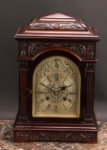 An early 20th century mahogany bracket-form mantel clock, 14cm arched silvered dial, Roman and