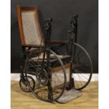 An early to mid-20th century American oak hand-crank wheelchair, by Gendron Wheel Company,