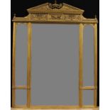A substantial Louis XVI Revival giltwood and gesso salle de bal looking glass, broken-arch