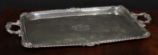 A large George IV Irish silver rounded rectangular tray, of substantial gauge, gadrooned shell and