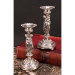 A pair of sculptural silver plated table candlesticks, cast in the Renaissance Revival taste with