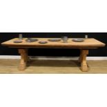 An early 20th century French Provincial walnut monastery refectory table, rectangular top, shaped