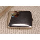 An early 20th century silver and enamel curved rounded rectangular cigarette case, hinged cover with
