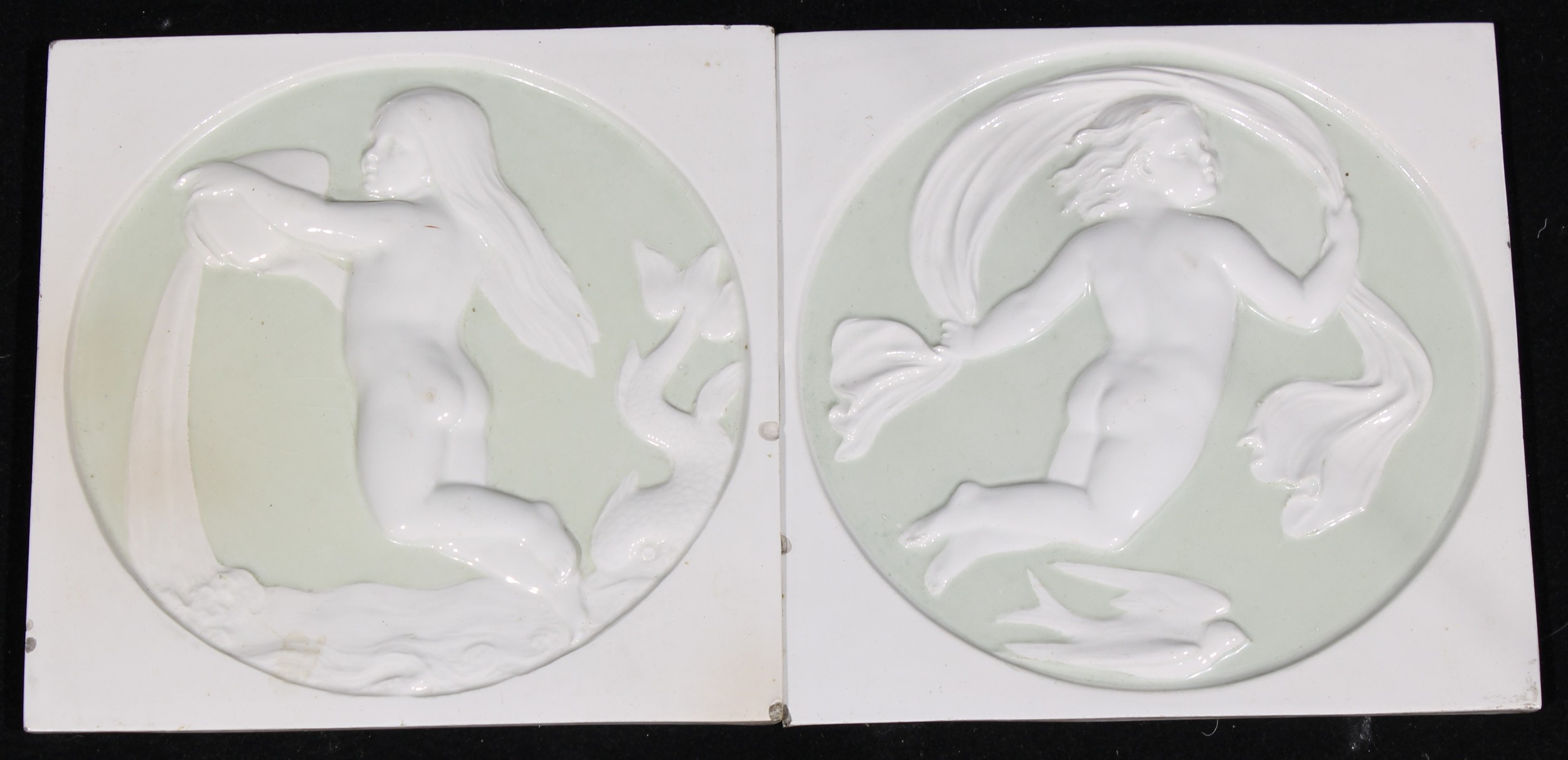 A pair of Copeland wall tiles, moulded in relief with allegories of Water and Air, late 19th