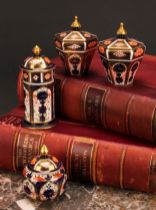 An associated pair of Royal Crown Derby 1128 Imari pattern tapered hexagonal jars and covers, 10cm