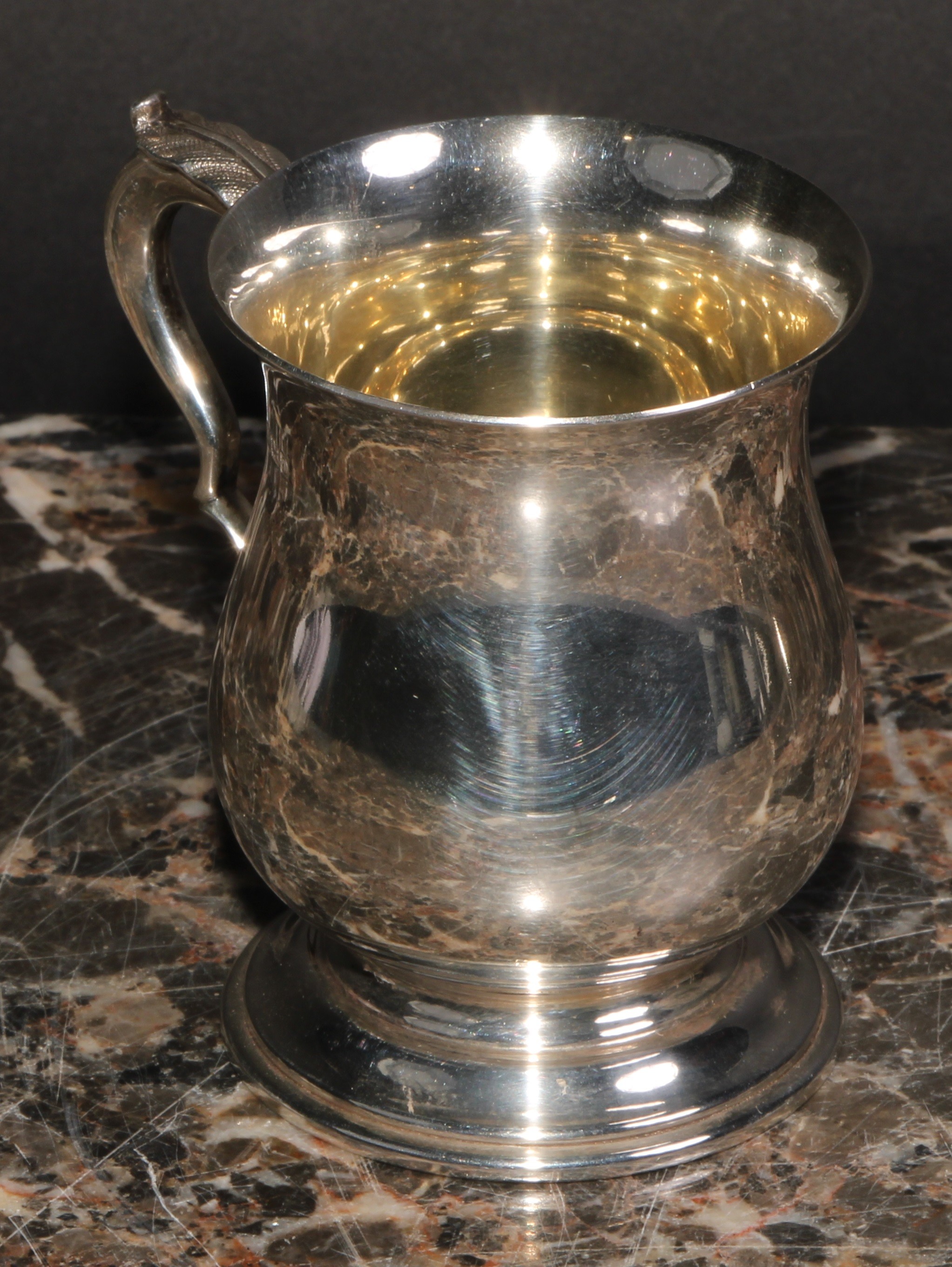 An Elizabeth II silver bell shaped mug, of George II design, quite plain, acanthus-capped double - Image 2 of 4