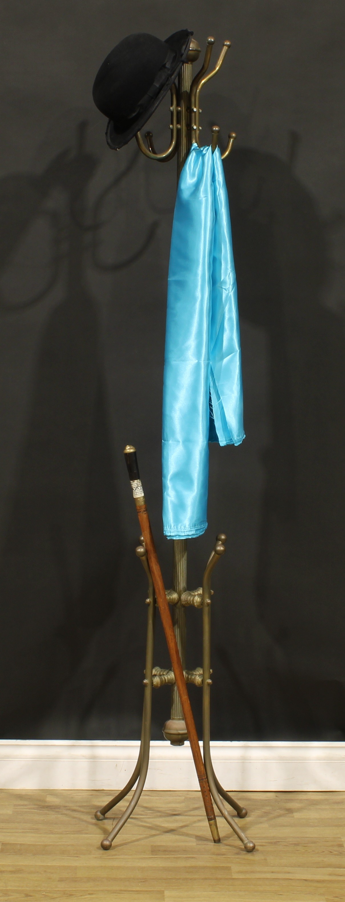 An early 20th century brass coat and hat stand, possibly American, in the Aesthetic Movement
