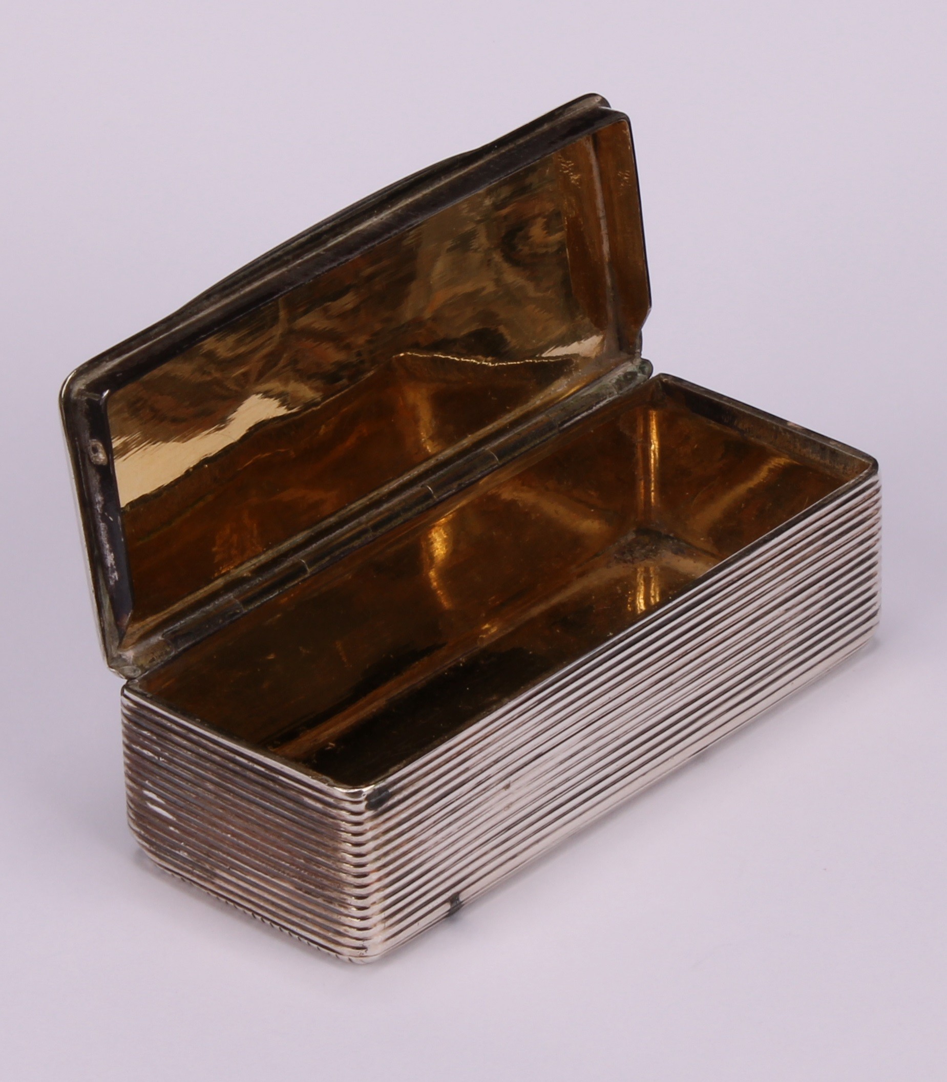 A 19th century French silver rounded rectangular snuff box, hinged cover chased with a cartouche and - Image 4 of 4