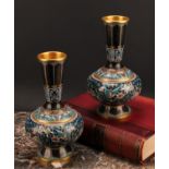 A pair of Chinese cloisonne enamel ovoid pedestal vases, brightly decorated in polychrome with