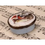 A George III South Staffordshire enamel oval patch box, hinged cover painted with a bird, pale