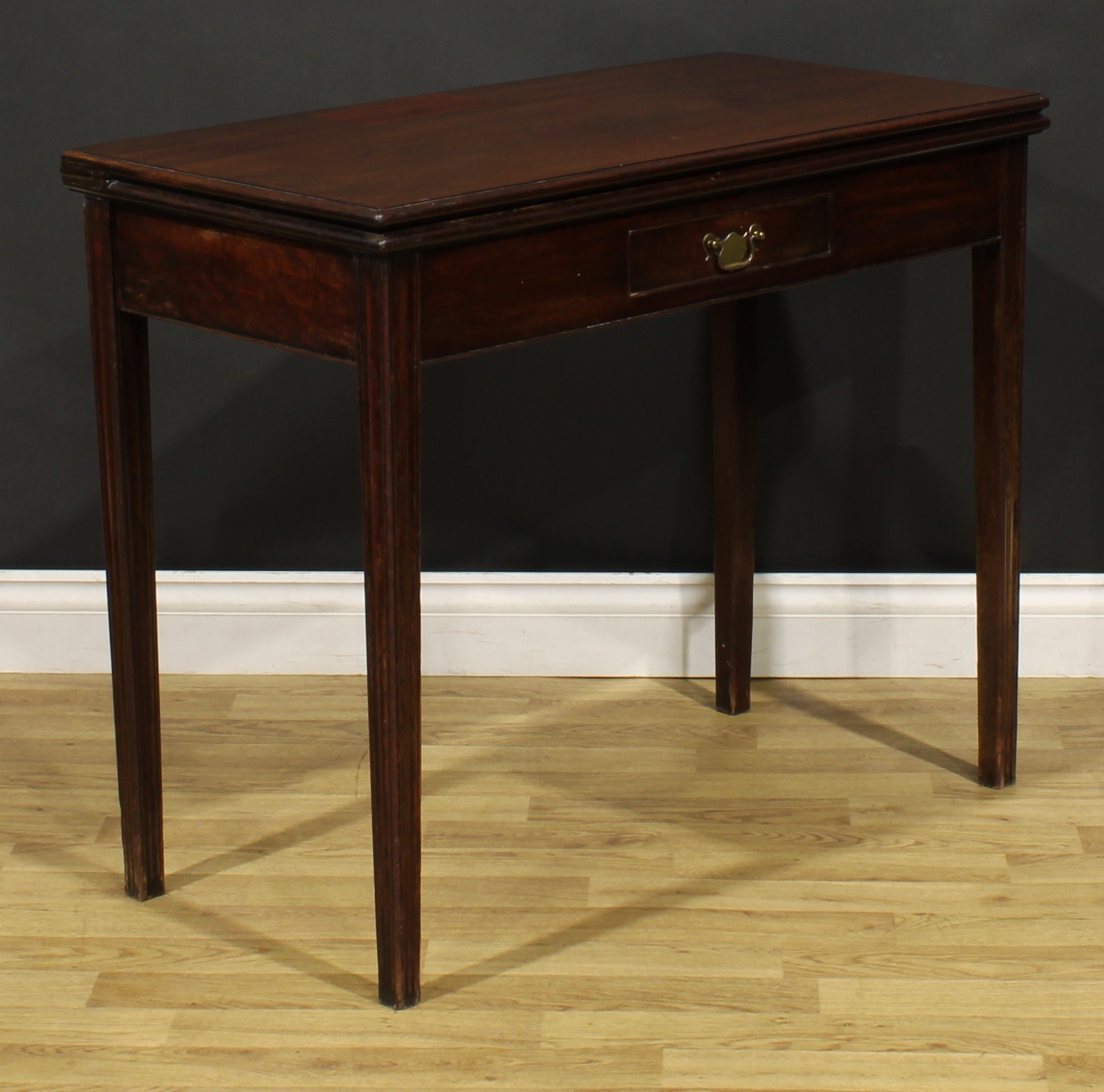 A George III mahogany card table, hinged top with moulded edge enclosing a baize lined playing - Image 4 of 7