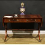 A Regency Revival mahogany sofa table, crossbanded rounded rectangular top with fall leaves above