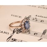 A 19th century pale blue and white sapphire effect paste cluster ring, central cushion cut pale blue