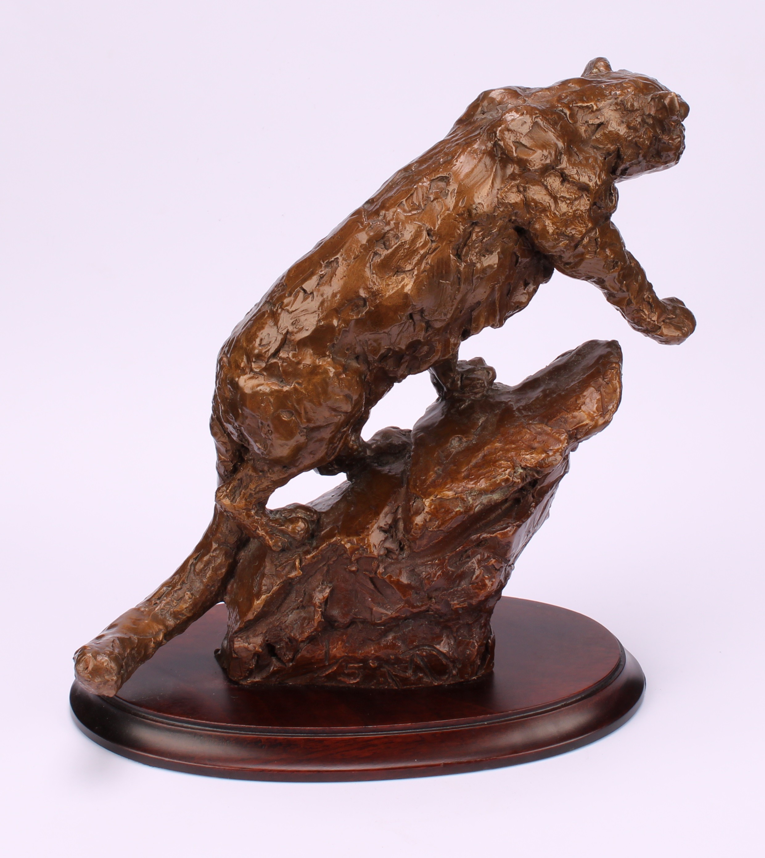 Contemporary School, a patinated bronze, leopard on a rock, signed with monogram MD? and numbered - Image 4 of 5