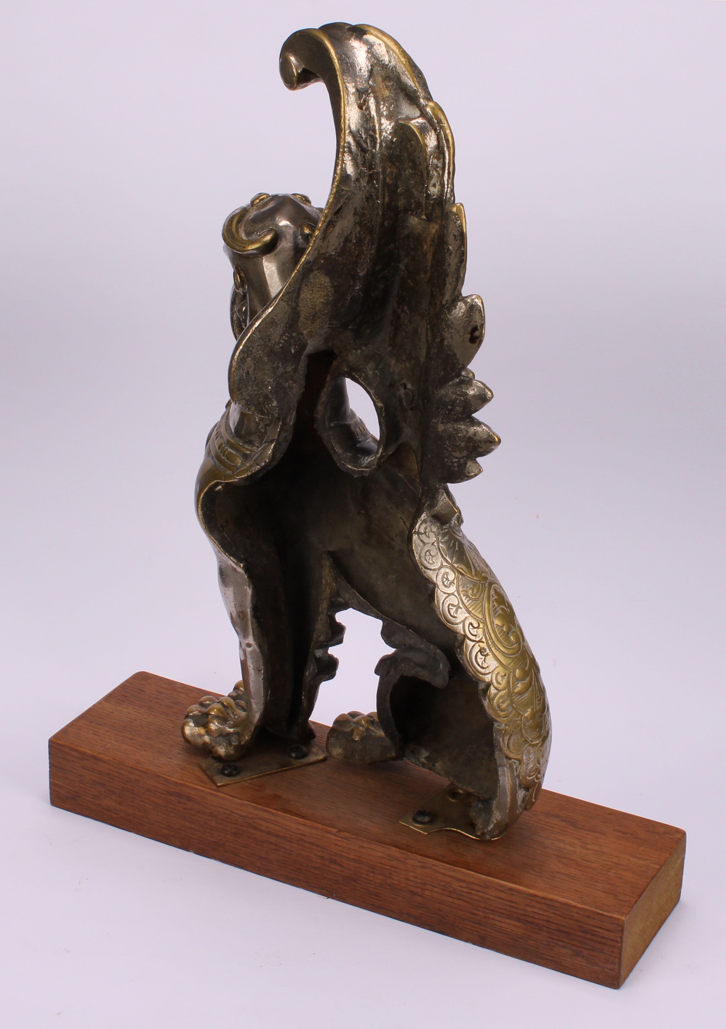 A 19th century parcel-silvered model, cast as a winged lion, 31cm high, hardwood plinth, 35cm high - Image 4 of 4