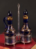 A 19th century Belgian silver two-bottle oil and vinegar cruet, gilded blue glass decanters and