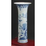 An 18th century Chinese blue and white sleeve vase, decorated with birds flying and perched