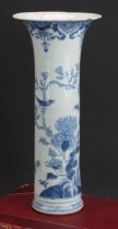 An 18th century Chinese blue and white sleeve vase, decorated with birds flying and perched
