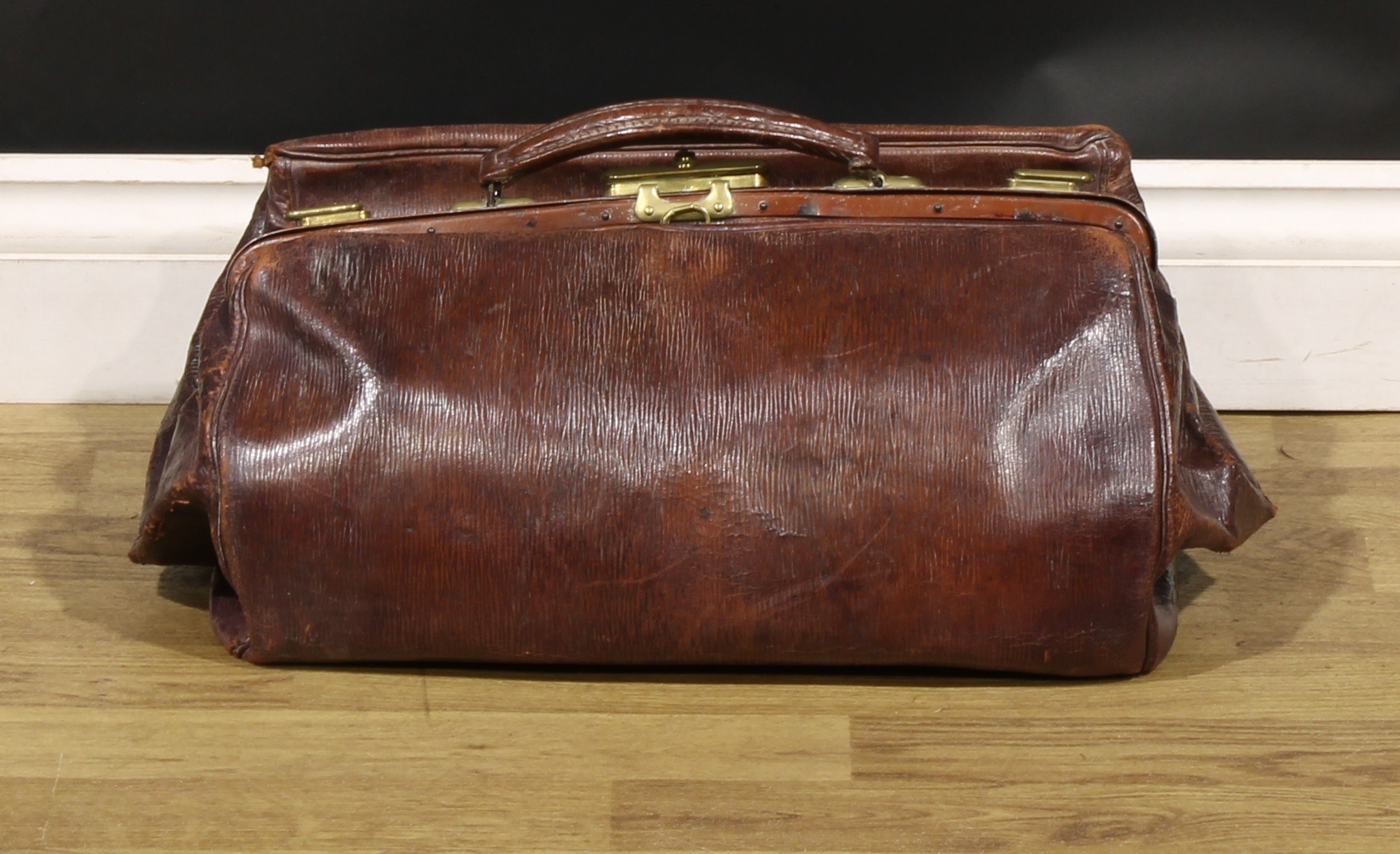 Vintage Luggage - a leather suitcase, bearing fragmentary labels for Southern Railway, 66cm wide; - Image 3 of 3