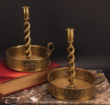 A pair of large late Victorian brass open-twist chambersticks, deep galleries pierced with borders