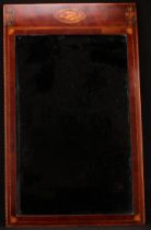 A 19th century mahogany rectangular looking glass, the frieze inlaid with oval shell patera and