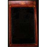 A 19th century mahogany rectangular looking glass, the frieze inlaid with oval shell patera and