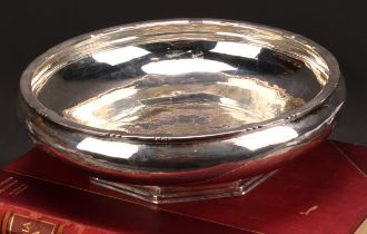 Cecil Walker of Hampstead (d.1983) - an Arts and Crafts silver fruit bowl, lightly planished, the